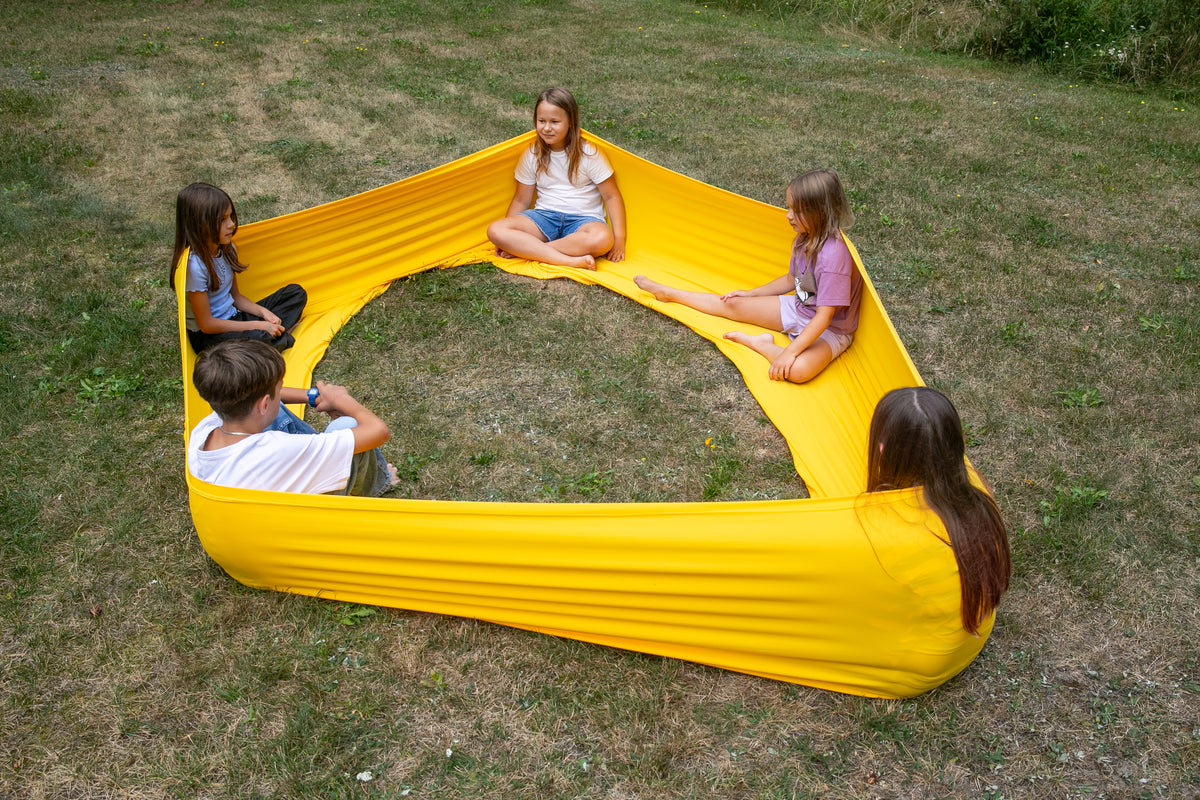 kids talkng together in the yellow flexible circle 