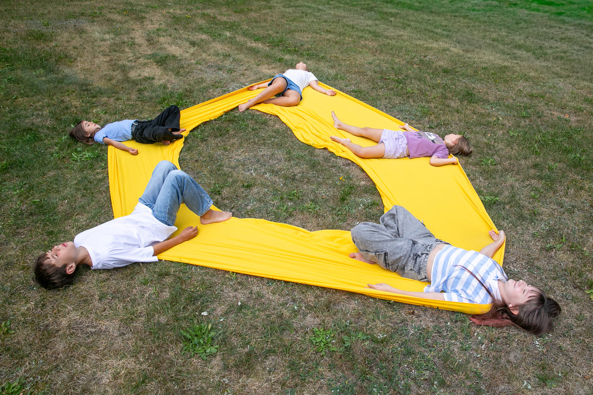 kids relaxing in the yellow flexible circle 